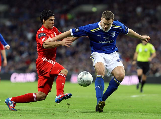 Ben Turner (right) in action against Luis Suarez in the 2012 League Cup Final 