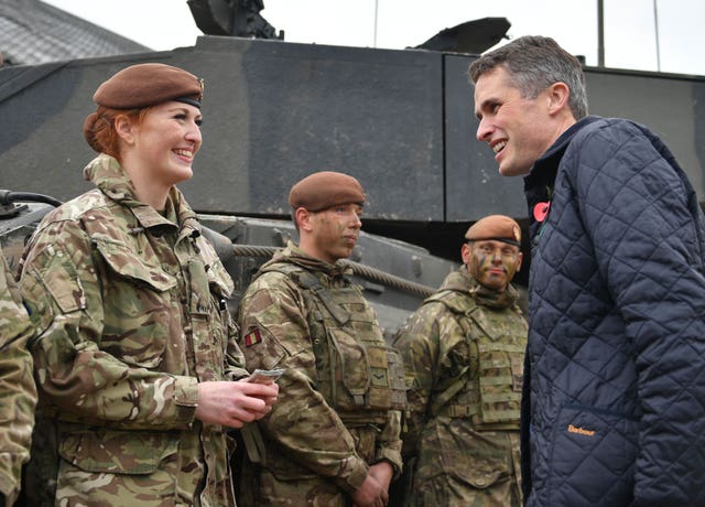 Defence Secretary Gavin Williamson speaking to Royal Wessex Yeomanry Tank Gunner reservist Lance Corporal Kat Dixon