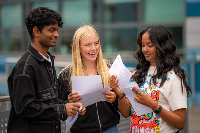 Dominic Sebastian, 16, (left) celebrates opening his results at St Mary Redcliffe and Temple School in Bristol (Ben Birchall/PA)