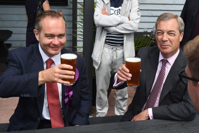 Mr Oakley, pictured enjoying a beer with Nigel Farage in 2017 (Victoria Jones/PA)