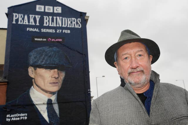 Steven Knight in front of a Peaky Blinders mural