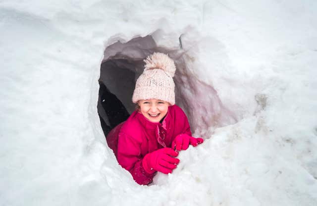 Elizabeth Lewin, 10, in a snow tunnel near Newby Head Farm