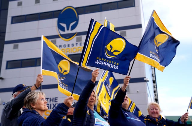 Worcester fans wave flags outside Sixways