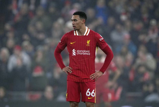 Liverpool's Trent Alexander-Arnold stands with hands on hips