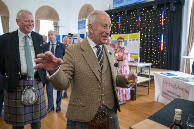 The King has a dram of whisky
