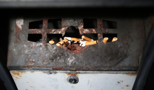 Cigarettes in an outside ashtray (Lynne Cameron/PA)