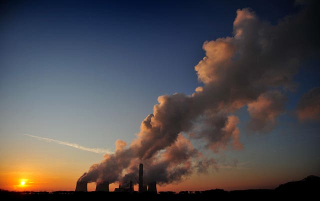 Sun setting over a coal-fired power station, since closed, in the UK