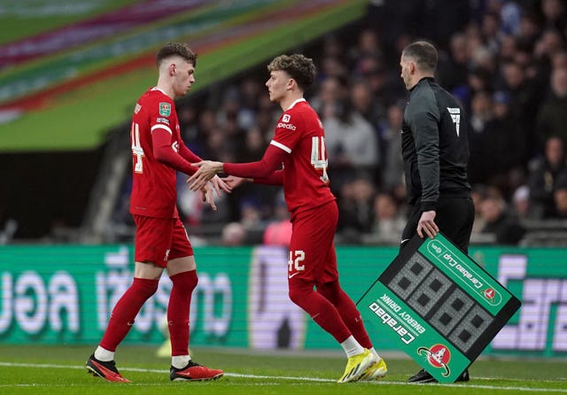Liverpool’s Conor Bradley (left) is replaced by substitute Bobby Clark during the Carabao Cup final