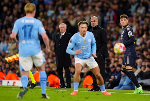 Manchester City manager Pep Guardiola watches his players in action