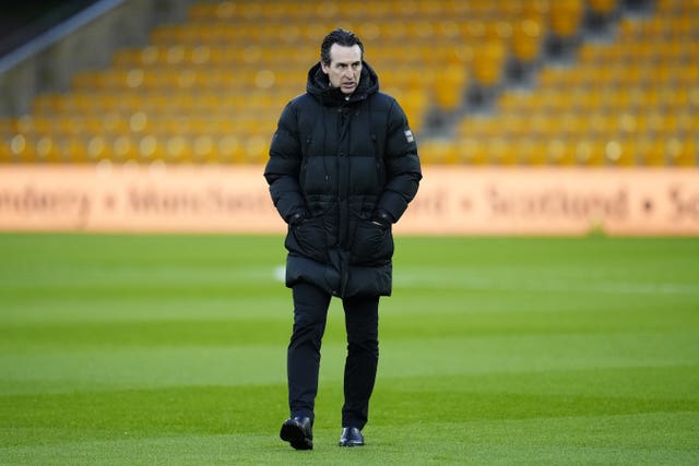 Unai Emery walks on the pitch at Molineux