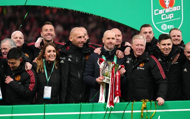 Manchester United's backroom staff celebrate winning the Carabao Cup