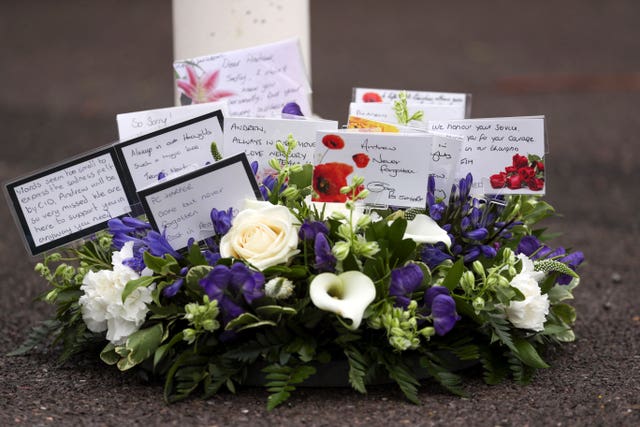 A floral tribute which was laid during a memorial service for Pc Andrew Harper at Newbury police station to mark the first anniversary of his death