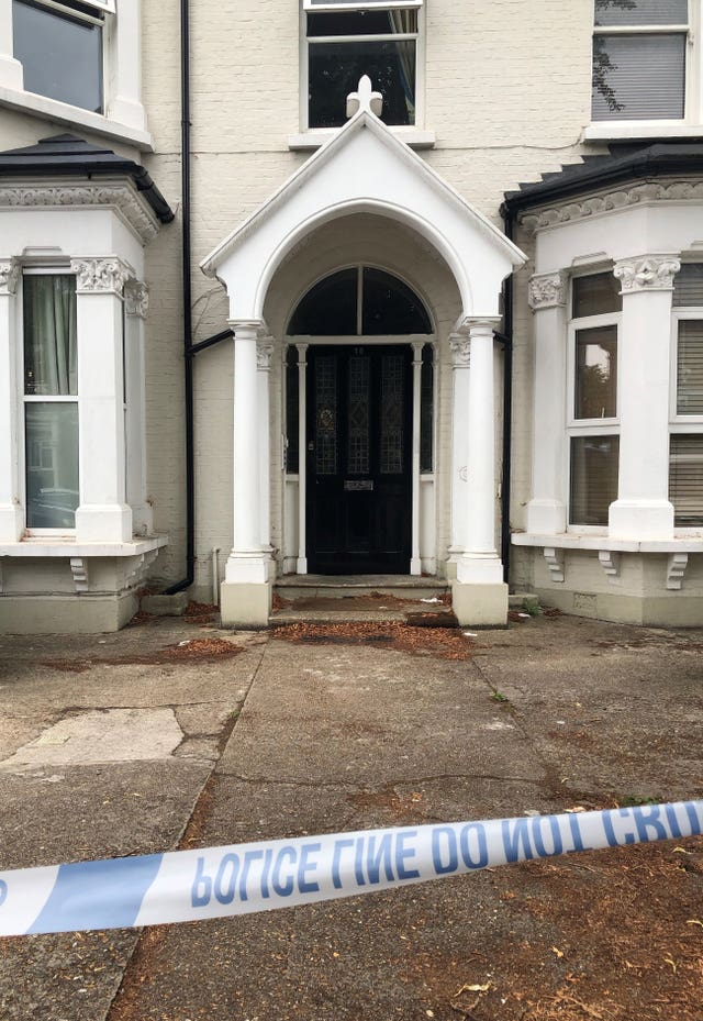 Police tape outside an address in Cumberland Park, Acton (Thomas Hornall/PA)