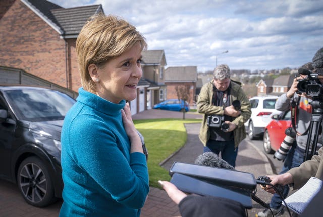 Sturgeon outside her house