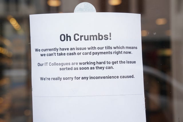 A sign put up on the door of a Greggs shop headed 