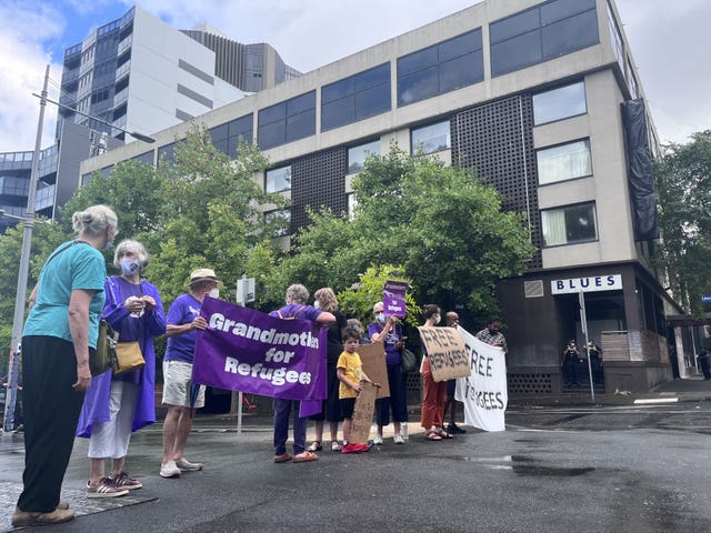 Refugee advocates gather outside the Park Hotel on Friday in Melbourne