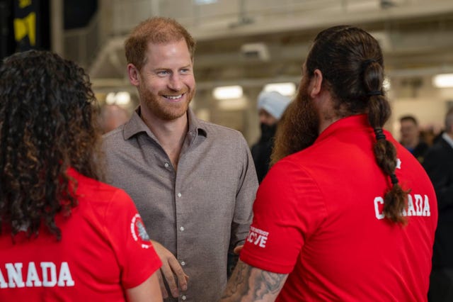 Harry chatting to students