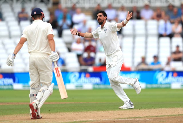 Ishant Sharma (right) celebrates taking the wicket of Alastair Cook (Mke Egerton/PA).