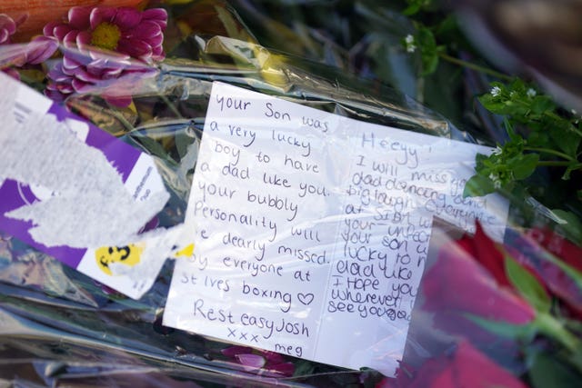 Flowers left at the scene in Meridian Close, Bluntisham (Joe Giddens/PA) 