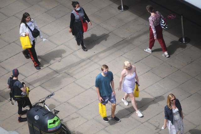 People wearing face covering on Oxford Street, London