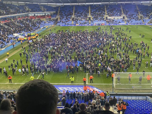 Reading fans invade the pitch against Port Vale