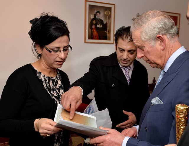 The Prince The Prince of Wales at St Thomas Cathedral, the Syrian Orthodox Church in west London, talking to Kais Dawood and his wife Selwa who fled Iraq (John Stillwell/PA)of Wales visits Syrian Orthodox Church