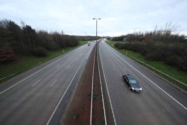 A near empty road at junction 44 of the M1 motorway near Leeds, Yorkshire, at 8.21am the morning after Prime Minister Boris Johnson set out further measures as part of a lockdown in England in a bid to halt the spread of coronavirus