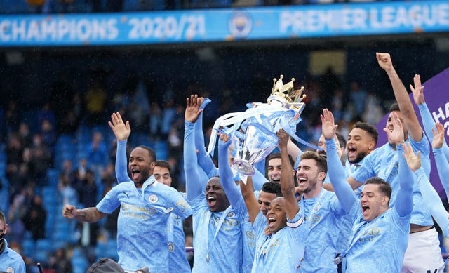 Manchester City’s Fernandinho lifts the Premier League trophy last season