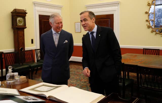 Mark Carney meeting Charles when he was the prince of Wales (Kirsty Wrigglesworth/PA)