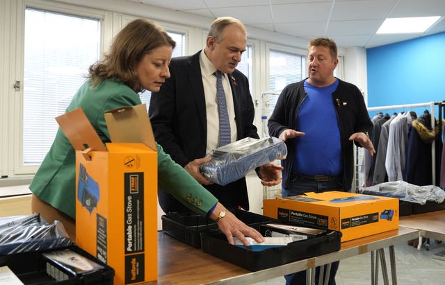 Sir Ed Davey helps pack winter survival kits to be sent to Ukraine