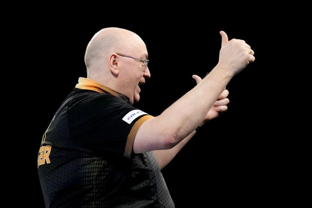 Andrew Gilding celebrates his victory over Martin Lukeman at the World Darts Championship