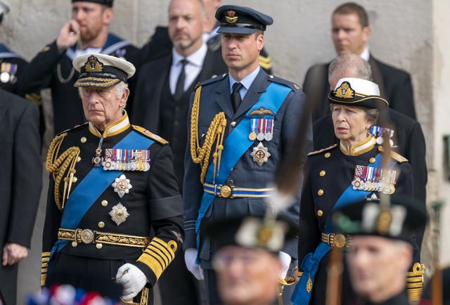 King Charles III, the Prince of Wales and Princess Royal in black military uniforms