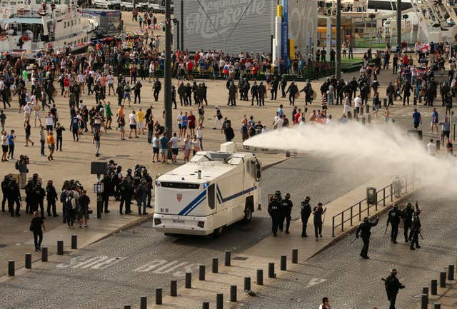Police fire water cannons to control the fighting after football fans clashed ahead of England vs Russia at Euro 2016 (Niall Carson/PA)