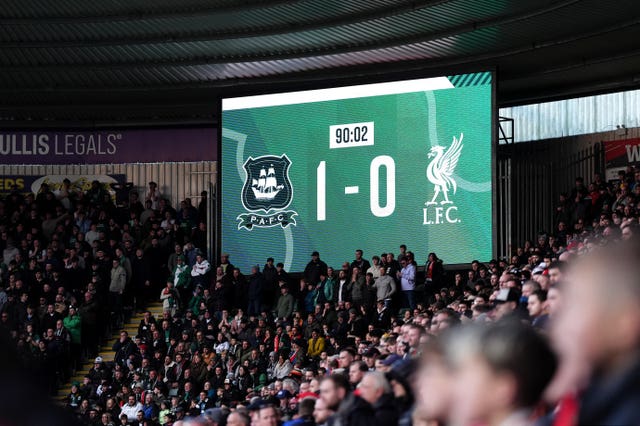 A scoreboard showing Plymouth 1 Liverpool 0