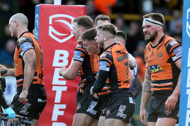 Castleford celebrate a try against St Helens on March 15, the last day of action before the competition was suspended