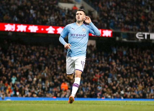 Phil Foden celebrates scoring against Port Vale