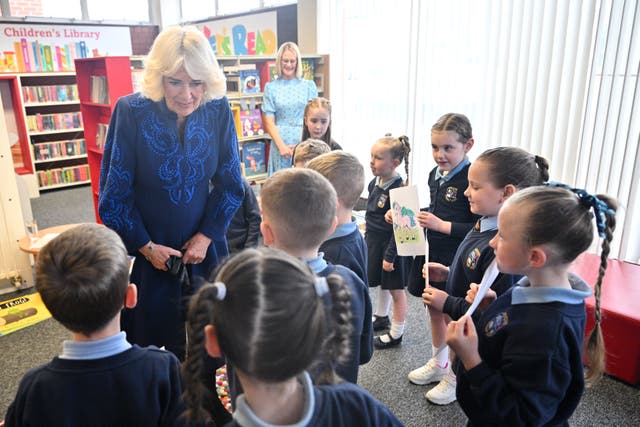 Camilla talking to school children in a library