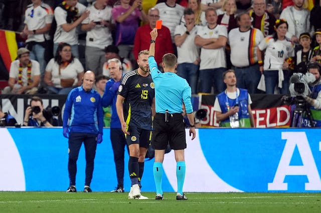 Referee Clement Turpin shows Scotland’s Ryan Porteous a red card after a VAR check
