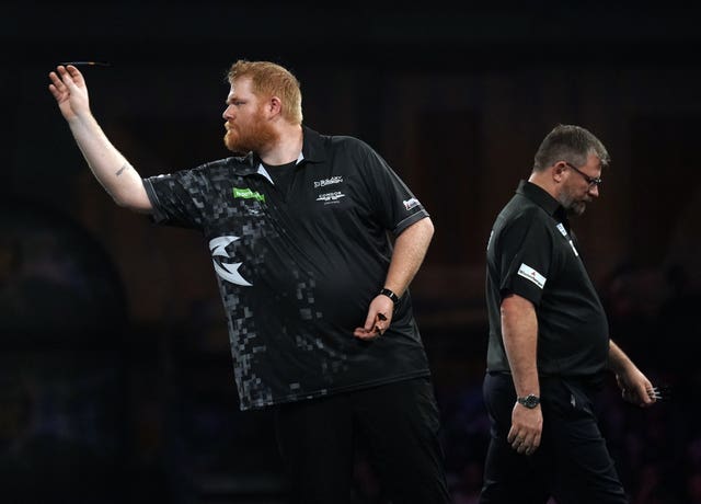 Matt Campbell, left, is returning home after his second-round win at Ally Pally