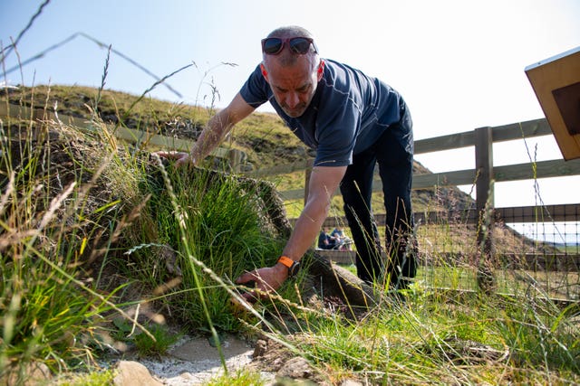 A worker at the Sycamore Gap tree site