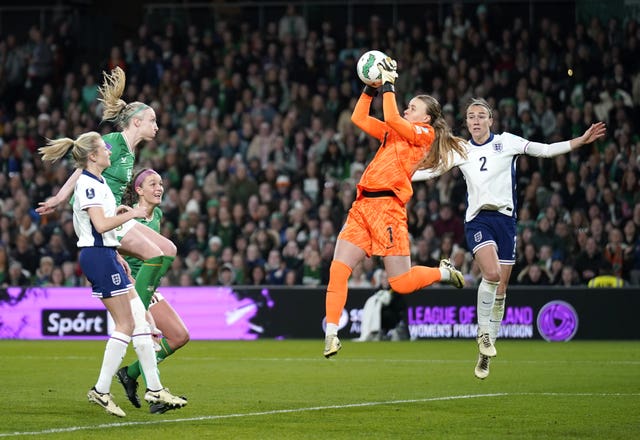 England goalkeeper Hannah Hampton, centre, claims a high ball against the Republic of Ireland
