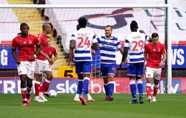 Reading’s George Puscas, centre, netted from the penalty spot at Charlton