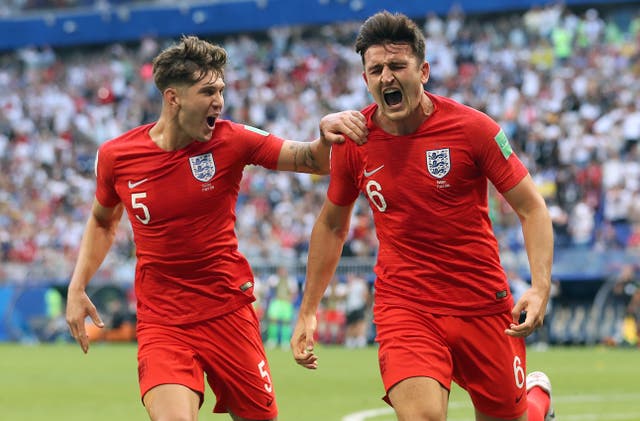 Harry Maguire, right, celebrates his goal against Sweden