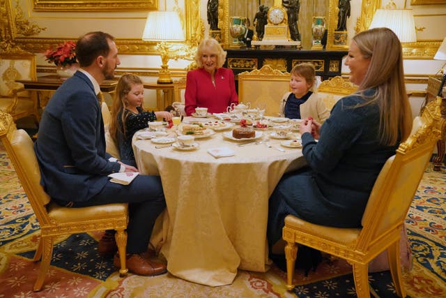 Olivia with her sister Imogen, four, (second left), father Matt (left), and mother Lisa (right) at Windsor Castle