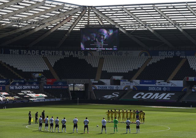 In Wales, Swansea and Wycombe players stood for a minute's silence