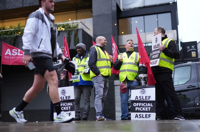 Train drivers from the Aslef union on the picket line at Euston station in London 