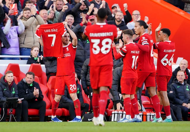 Liverpool’s Diogo Jota celebrates a goal by displaying Luis Diaz's shirt