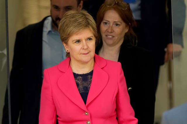 Nicola Sturgeon exiting a building