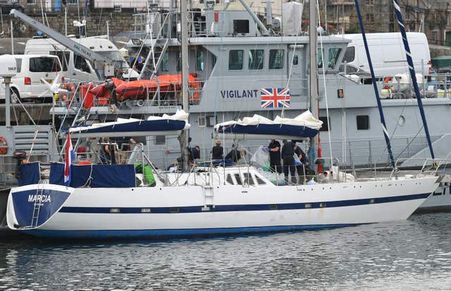 Drugs are unloaded from a boat by officers at Newlyn harbour 