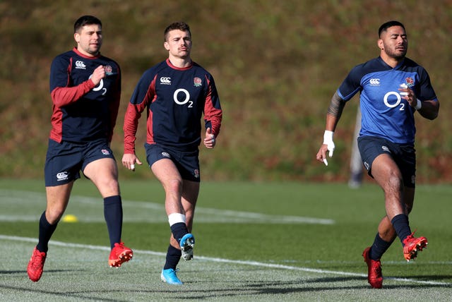 England’s Henry Slade, centre, and Manu Tuilagi have a strong bond on and off the pitch